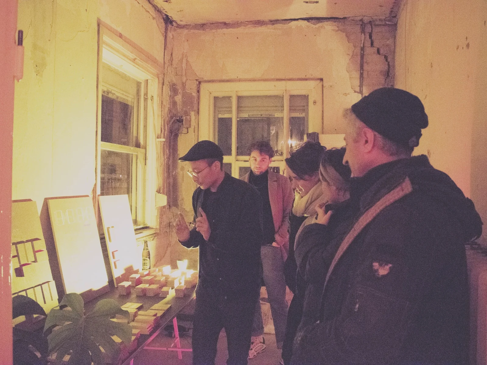 Hansol explaining the blocks to a group of visitors